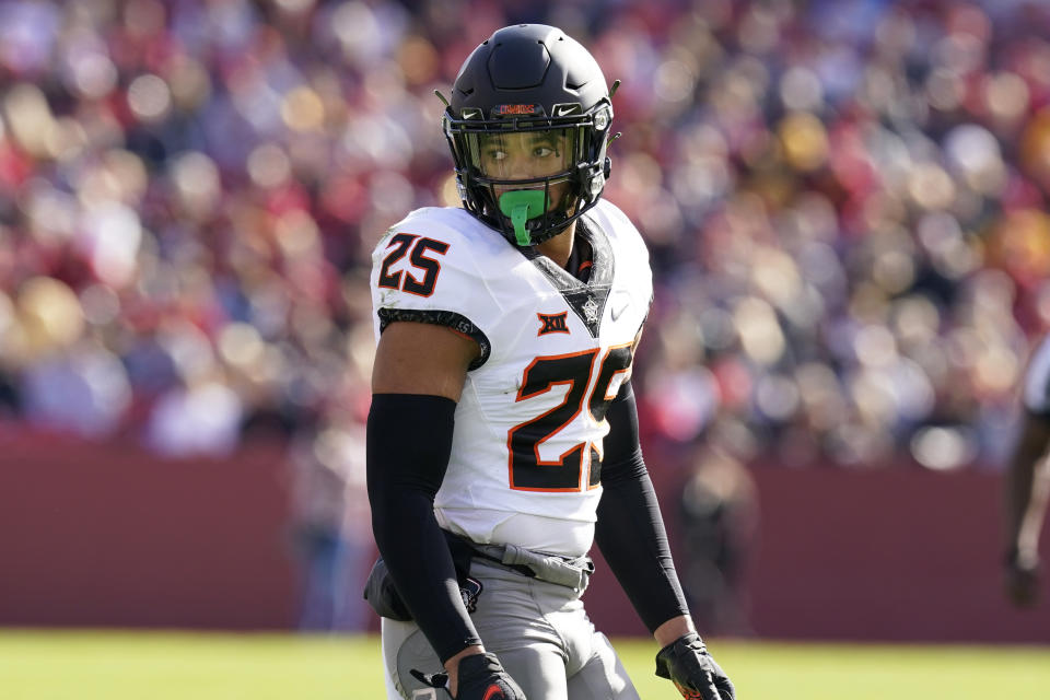 FILE - Oklahoma State safety Jason Taylor II (25) walks on the field during the first half of an NCAA college football game against Iowa State, on Oct. 23, 2021, in Ames, Iowa. Defensive lineman Collin Oliver and safety Jason Taylor II are preseason All-Big 12 picks. (AP Photo/Charlie Neibergall, File)