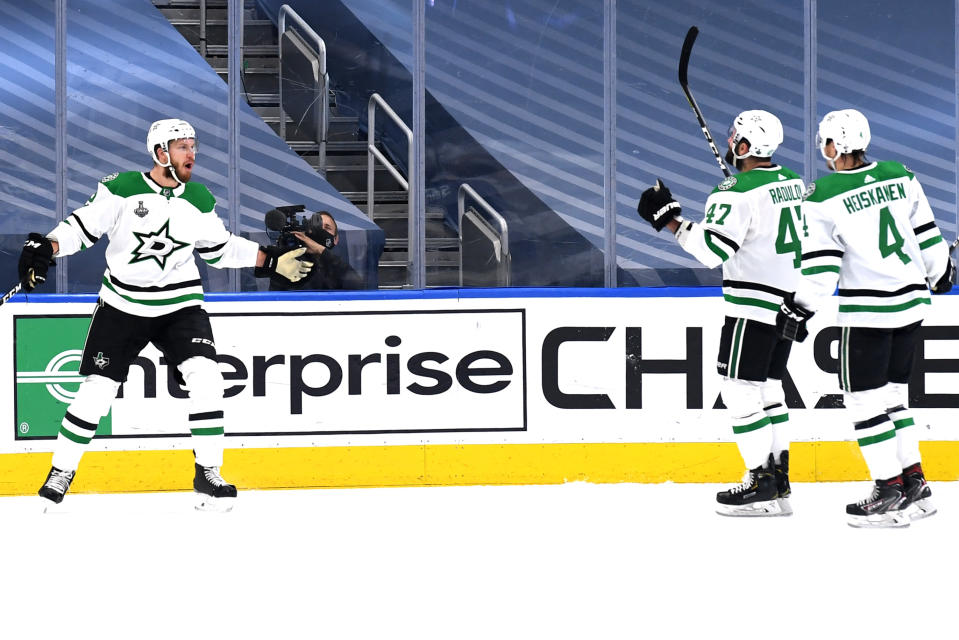 EDMONTON, ALBERTA - SEPTEMBER 19: Jamie Oleksiak #2 of the Dallas Stars celebrates with Alexander Radulov #47 and Miro Heiskanen #4  after Oleksiak scored in the second period of Game One of the NHL Stanley Cup Final between the Dallas Stars and the Tampa Bay Lightning at Rogers Place on September 19, 2020 in Edmonton, Alberta, Canada. (Photo by Andy Devlin/NHLI via Getty Images)