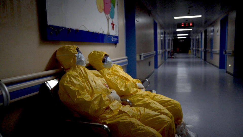 Nurses collapse from exhaustion in a hospital hallway during the peak of the COVID-19 outbreak in Wuhan, China. As seen in 76 Days, directed by Hao Wu, Weixi Chen and Anonymous. Image courtesy of 76 Days LLC.