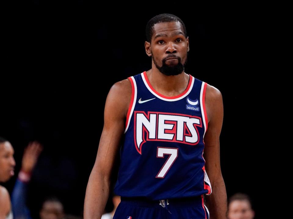 Kevin Durant looks on during a Nets game in 2022.