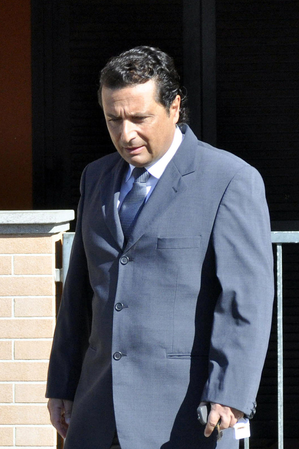 FILE -- In this file photo taken in Grosseto on May 14 2013ormer captain of the Costa Concordia luxury cruise ship Francesco Schettino leaves his house to attend a closed-door hearing. The Italian captain of the Costa Concordia cruise ship was ordered on Wednesday to stand trial for manslaughter in the luxury liner's shipwreck off the coast of Tuscany, which killed 32 people. Judge Pietro Molino, at a closed door hearing in the town of Grosseto, agreed to prosecutors' requests that Francesco Schettino should be tried on charges of manslaughter, causing the shipwreck and abandoning the vessel while many of the 4,200 passengers and crew were still aboard. (AP Photo/Giacomo Aprili)