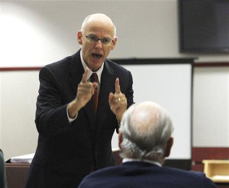 Attorney Richard Escobar motions toward his client Curtis Reeves, Jr., as he makes closing arguments during Reeves' bail hearing in Dade City, Florida, February 7, 2014. REUTERS/Andy Jones/Tampa Tribune/Pool