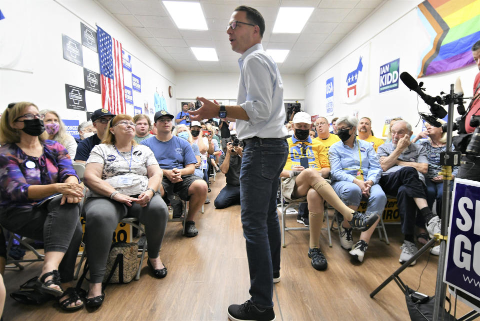 Josh Shapiro, Pennsylvania's Democratic nominee for governor, records a video message on Cindy Barnes' cell phone for children after he spoke at a campaign event at Franklin County Democratic Party headquarters, Sept. 17, 2022, in Chambersburg, Pa. (AP Photo/Marc Levy)