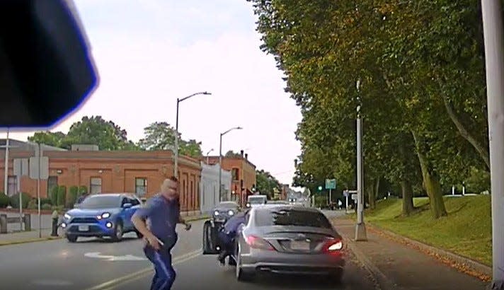 A Brockton man was charged with dragging a state trooper during this traffic stop on Montello Street in Brockton on Wednesday, Sept. 13, 2023.