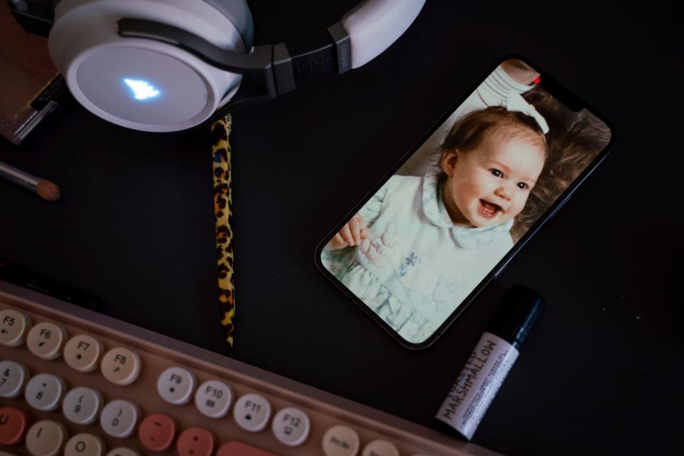 A baby photo of Teraysa Noyes, now 33, sits on a work desk at her home in Grosse Pointe Park on Tuesday, April 11, 2023. "My experience was a huge flood of relief and answers to questions I had," said Noyes, who was diagnosed with autism at age 32. "But after that, it was quickly followed up with feelings of grief and anger and 'this isn't fair.' Once we start unmasking, it's hard for us to put the mask back on."