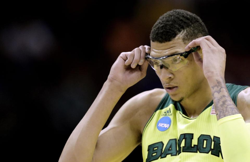 Baylor&#39;s Isaiah Austin adjusts his glasses during the first half of a second-round game against Nebraska in the NCAA college basketball tournament Friday, March 21, 2014, in San Antonio. (AP Photo/Eric Gay)