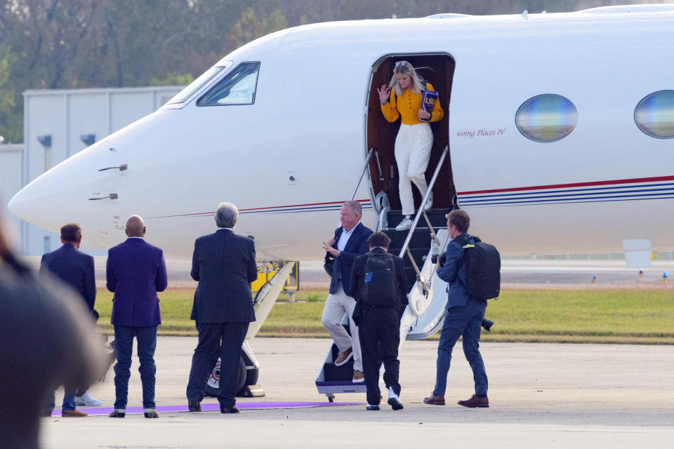 New LSU football coach Brian Kelly steps off a plan as he after arrives at Baton Rouge Metropolitan Airport, Tuesday, Nov. 30, 2021, in Baton Rouge, La. Kelly, formerly of Notre Dame, is said to have agreed to a 10-year contract with LSU worth $95 million plus incentives. (AP Photo/Matthew Hinton)