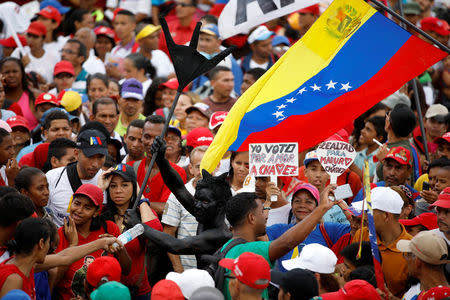 Supporters of Venezuela's President Nicolas Maduro attend his closing campaign rally in Caracas, Venezuela, May 17, 2018. REUTERS/Carlos Garcia Rawlins