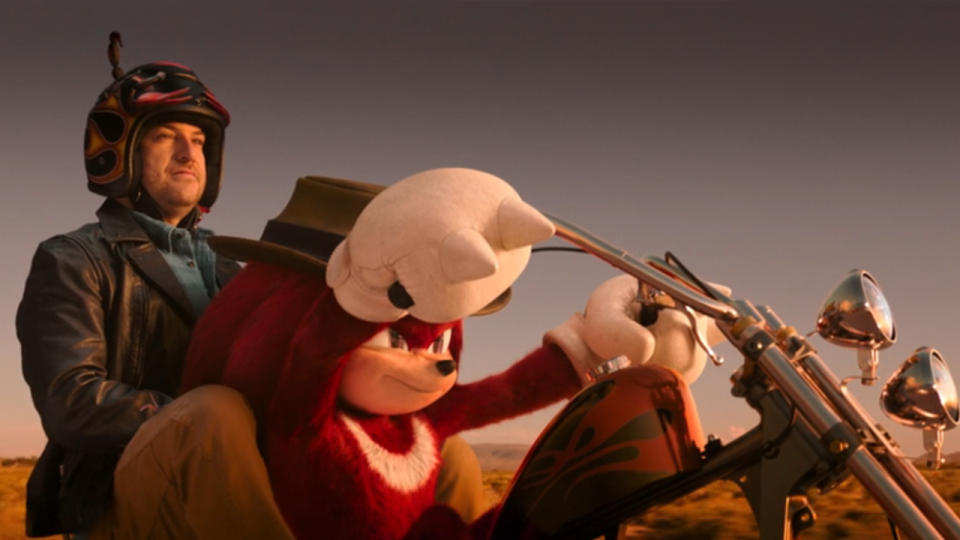 Wade Whipple (Adam Pally) and Knunckles riding a motorcycle on Knuckles