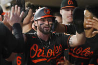 Baltimore Orioles' Ryan McKenna is congratulated after scoring against the Minnesota Twins during the eighth inning of a baseball game Friday, July 1, 2022, in Minneapolis. The Twins won 3-2. (AP Photo/Bruce Kluckhohn)