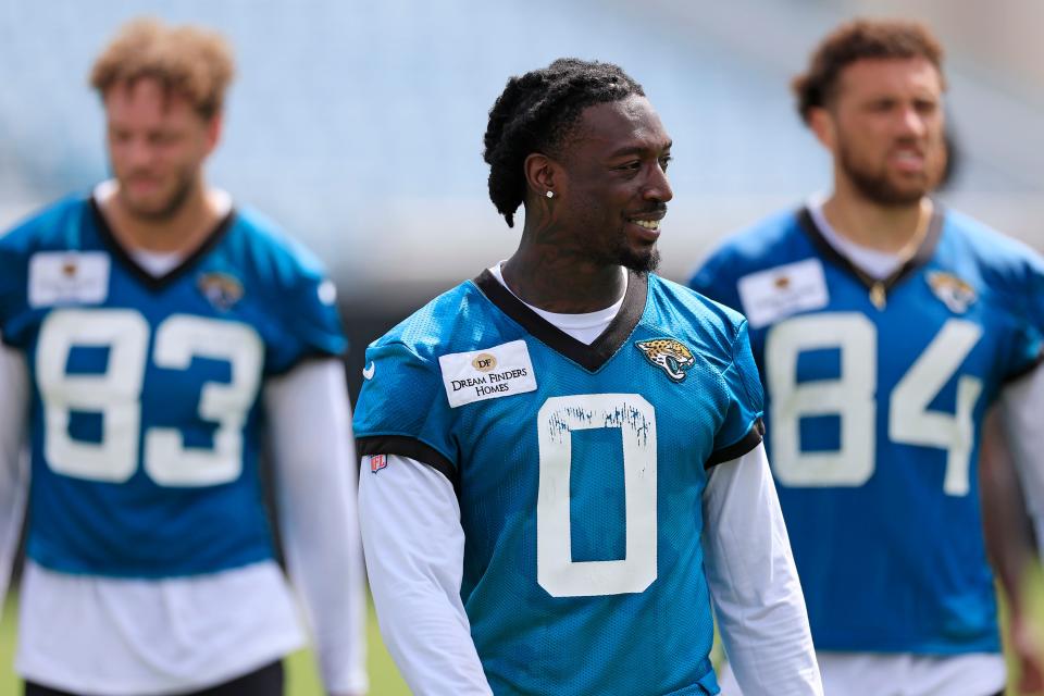 Jacksonville Jaguars wide receiver Calvin Ridley (0) walks off the field with wide receiver Jacob Harris (83) and wide receiver Elijah Cooks (84) after the third and final day of a mandatory minicamp Monday, June 12, 2023 at TIAA Bank Field in Jacksonville, Fla. 