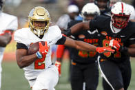 North running back Joshua Kelley of UCLA (2) carries the ball during the second half of the Senior Bowl college football game Saturday, Jan. 25, 2020, in Mobile, Ala. (AP Photo/Butch Dill)