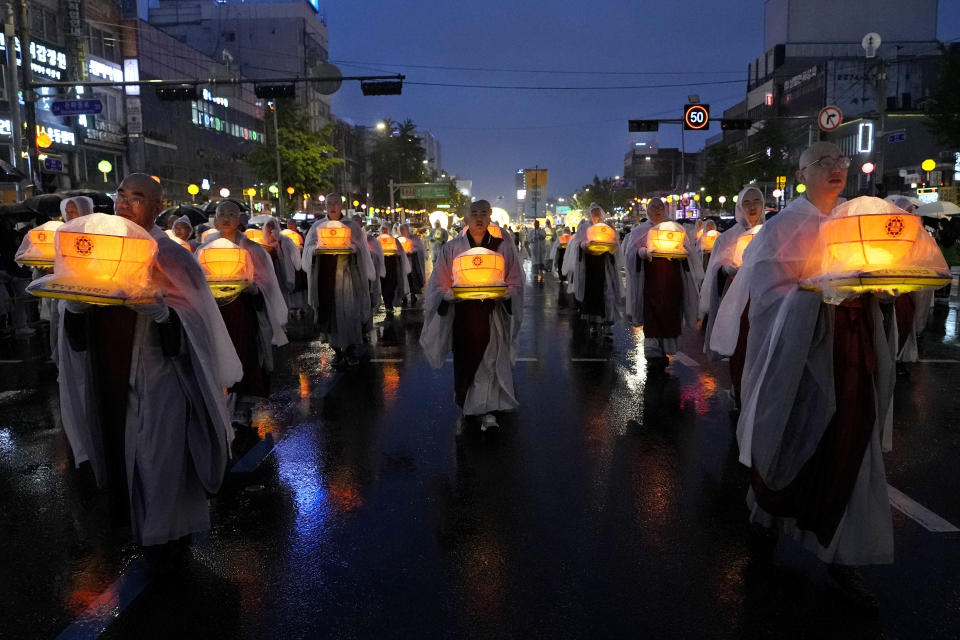 Buddhist monks walk in a lantern parade during the Lotus Lantern Festival, ahead of the birthday of Buddha at Dongguk University in Seoul, South Korea, Saturday, May 11, 2024. (AP Photo/Ahn Young-joon)
