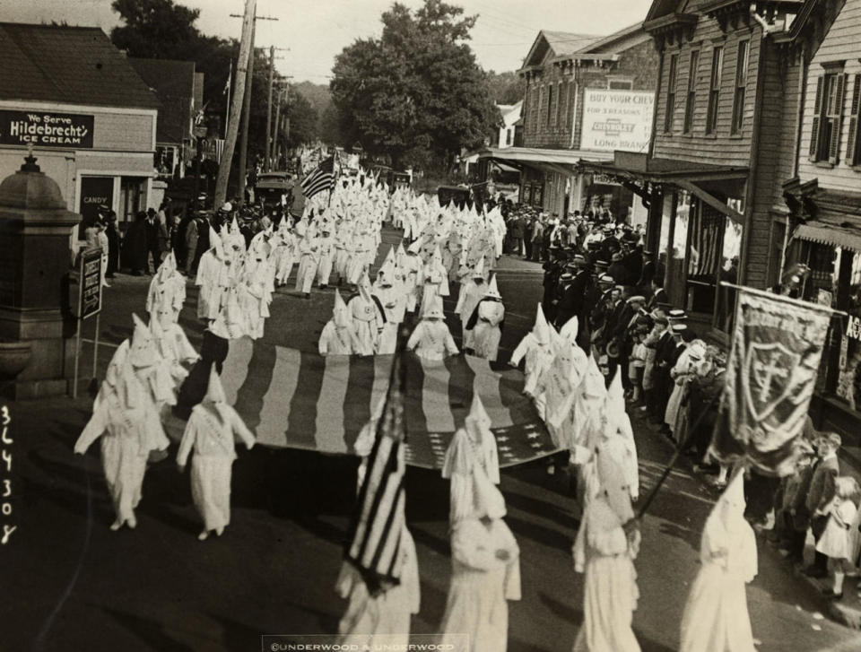 <p>Photo showing the Klansmen marching down Broadway, Long Branch, New Jersey attired in their full regalia in 1924. They have just established new headquarters in Long Branch. (Photo: George Rinhart/Corbis via Getty Images) </p>