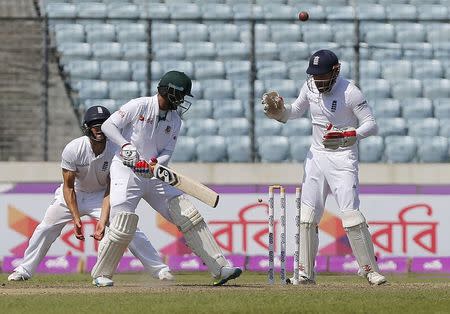 Cricket - Bangladesh v England - Second Test cricket match - Sher-e-Bangla Stadium, Dhaka, Bangladesh - 30/10/16. Bangladesh's Shakib Al Hasan (C) is bowled. REUTERS/Mohammad Ponir Hossain