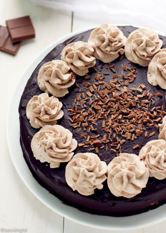 <p>Oreo cookie crust, light chocolate cheesecake, covered with chocolate ganache and topped with homemade chocolate whipped cream. Get the recipe <strong><a href="http://cookinglsl.com/triple-chocolate-cheesecake-recipe/" rel="nofollow noopener" target="_blank" data-ylk="slk:HERE.;elm:context_link;itc:0;sec:content-canvas" class="link rapid-noclick-resp">HERE.</a></strong></p>