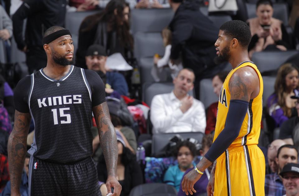 DeMarcus Cousins and Paul George make plans to grab dinner in New Orleans. (Getty Images)
