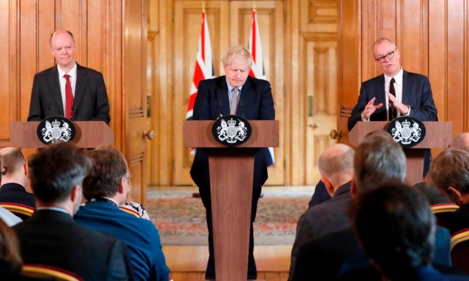 Boris Johnson flanked by chief medical officer to the government, Chris Whitty, left, and the chief scientific adviser, Sir Patrick Vallance, right.