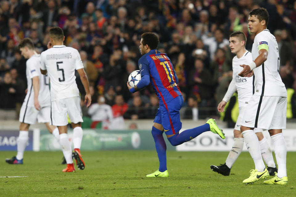 Barcelona's Brazilian forward Neymar (C) celebrates after scoring a penalty kick past dejected PSG players during the UEFA Champions League round of 16 second leg football match FC Barcelona vs Paris Saint-Germain FC at the Camp Nou stadium in Barcelona on March 8, 2017. / AFP PHOTO / PAU BARRENA        (Photo credit should read PAU BARRENA/AFP/Getty Images)