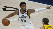 Utah Jazz guard Donovan Mitchell (45) brings the ball up court as Indiana Pacers guard T.J. McConnell defends in the first half during an NBA basketball game Friday, April 16, 2021, in Salt Lake City. (AP Photo/Rick Bowmer)