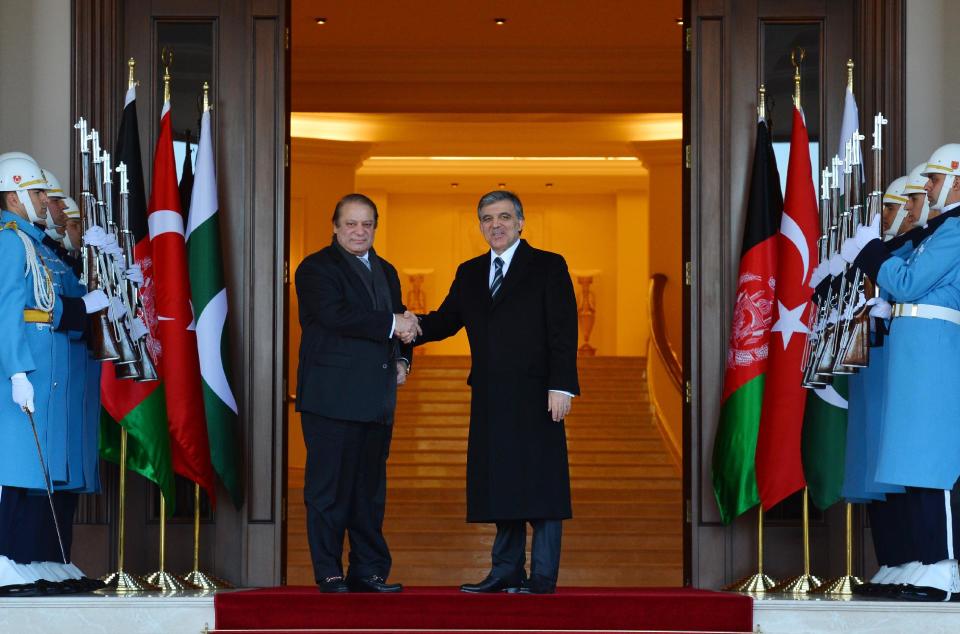 In this photo released by the Turkish Presidency Press Office, Turkish President Abdullah Gul, centre and Pakistan Prime Minister Nawaz Sharif shake hands before a meeting in Ankara, Turkey, Thursday, Feb. 13, 2014. Pakistan Prime Minister Nawaz Sharif and Afghanistan President Hamid Karzai are in Turkey for the 8th Afghanistan-Pakistan-Turkey Trilateral Summit. (AP Photo/Mustafa Oztartan, Turkish Presidency Press Office)