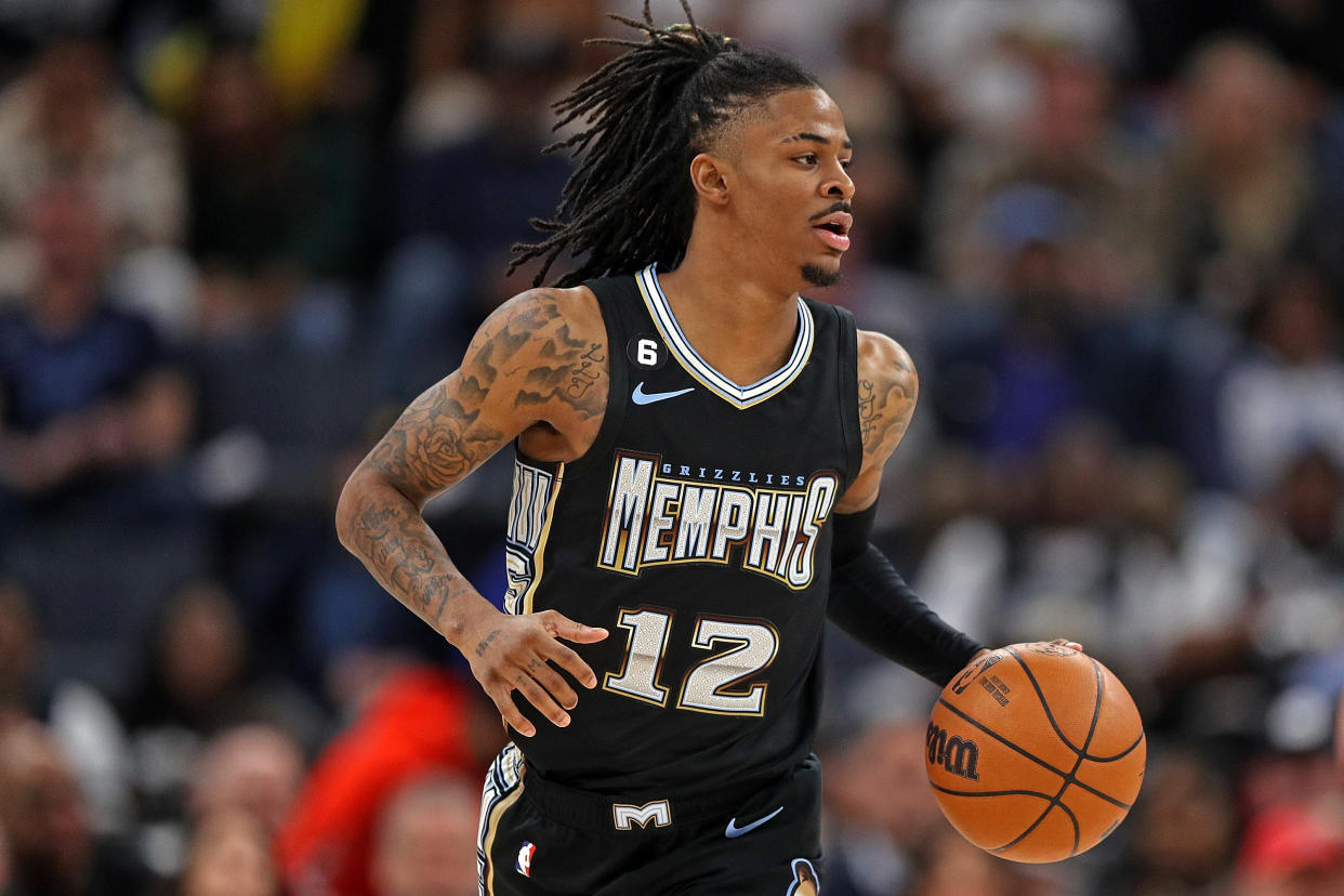 MEMPHIS, TENNESSEE - FEBRUARY 28: Ja Morant #12 of the Memphis Grizzlies brings the ball up court during the game against the Los Angeles Lakers at FedExForum on February 28, 2023 in Memphis, Tennessee. NOTE TO USER: User expressly acknowledges and agrees that, by downloading and or using this photograph, User is consenting to the terms and conditions of the Getty Images License Agreement. (Photo by Justin Ford/Getty Images)