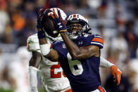 Auburn wide receiver Ja'Varrius Johnson (6) catches a pass as Mercer cornerback TJ Moore (25) defends during the second half of an NCAA college football game Saturday, Sept. 3, 2022, in Auburn, Ala. (AP Photo/Butch Dill)