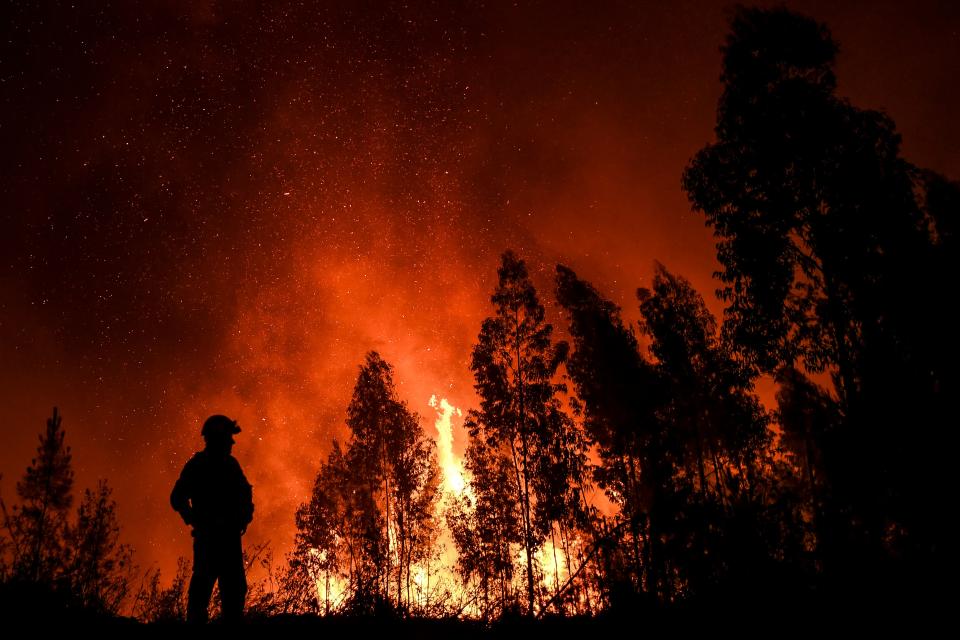 A firefighter monitors the progression of a wildfire at Amendoa in Macao, central Portugal on July 21, 2019. (Photo: Patricia De Melo Moreira/AFP/Getty Images)