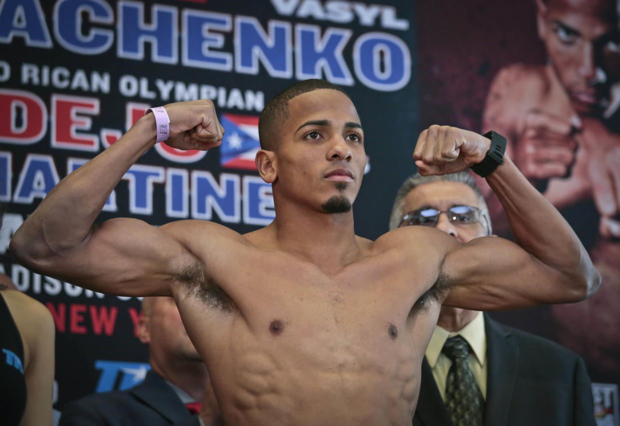 FILE - Puerto Rican boxer Felix Verdejo poses after his weigh-in at Madison Square Garden in New York, in this Friday, June 10, 2016, file photo. Puerto Rican boxer Félix Verdejo turned himself in to federal agents to face charges hours after authorities identified the body of a dead woman as his 27-year-old pregnant lover, officials said. The U.S. Attorney's Office said late Sunday, May 2, 2021,  that Verdejo was being charged with kidnapping and carjacking resulting in death and with intentionally killing an unborn child. (AP Photo/Bebeto Matthews, File)