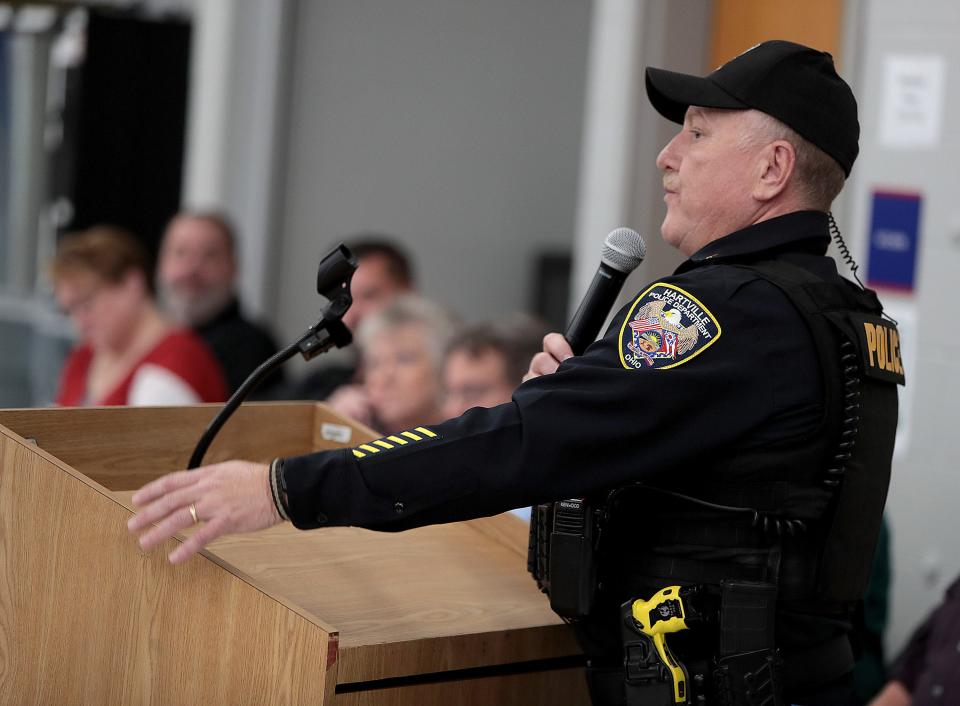 Hartville Village Police Sgt. Kevin Moore anwers questions at a special meeting looking at options for the future of their police force.