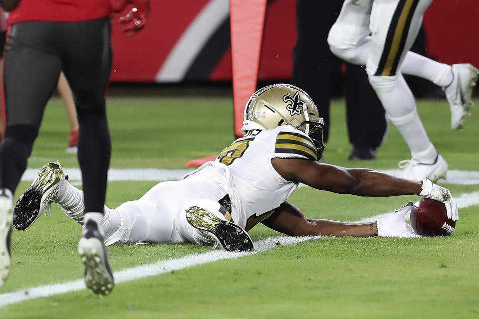 New Orleans Saints wide receiver Emmanuel Sanders (17) carries the football over the goal line after a 12-yard touchdown reception from quarterback Drew Brees during the first half of an NFL football game against the Tampa Bay Buccaneers Sunday, Nov. 8, 2020, in Tampa, Fla. (AP Photo/Mark LoMoglio)