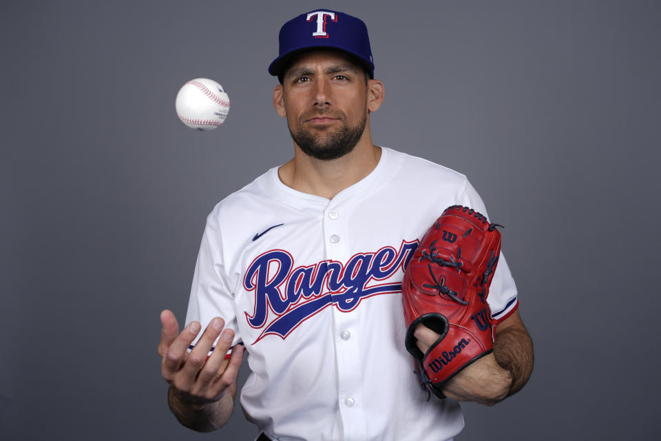 FILE - Nathan Eovaldi of the Texas Rangers baseball team poses in Surprise, Ariz., Feb. 20, 2024. Since returning from a second Tommy John surgery, Eovaldi is 41-27 and a two-time All-Star.(AP Photo/Carolyn Kaster, File)