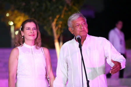 Leftist front-runner Andres Manuel Lopez Obrador of the National Regeneration Movement (MORENA), accompanied by his wife Beatriz Gutierrez Muller, delivers a message after arriving at the third and final debate in Merida, Mexico June 12, 2018. REUTERS/Lorenzo Hernandez