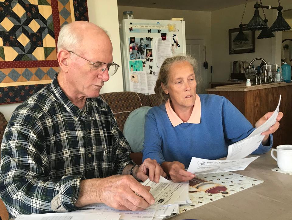 Tom Leith and his wife, Kathy, look over his medical records. Leith, 64, was diagnosed with rheumatoid arthritis in 1983 and was told he eventually would need a wheelchair. Thanks to a variety of drugs, including biologic medicines, he has continued to walk without the need for a wheelchair.