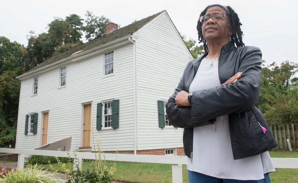 Linda Shockley, President of the Lawnside Historical Society, stands by the Peter Mott House, a Lawnside historical site and a stop on the Underground Railroad.