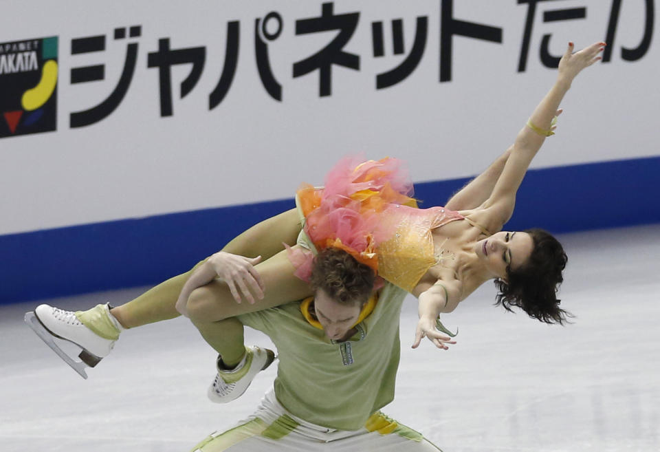 Nathalie Pechalat and Fabian Bourzat of France perform during Ice Dance free programs of the ISU Grand Prix Final figure skating in Fukuoka, western Japan, Saturday, Dec. 7, 2013. (AP Photo/Shizuo Kambayashi)