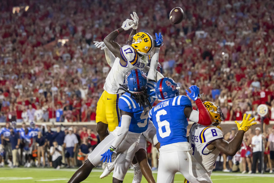 LSU wide receiver Chris Hilton Jr. (17) can't make the catch on the game's final play as Mississippi defensive back DeShawn Gaddie Jr. (9) defends during the second half of an NCAA football game on Saturday, Sept. 30, 2023, in Oxford, Miss. (AP Photo/Vasha Hunt)