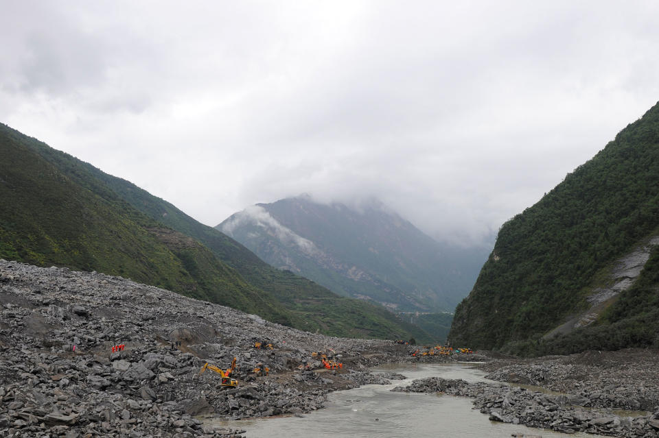 <p>Rescue workers search for survivors at the site of a landslide that occurred in Xinmo Village, Mao County, Sichuan province, China June 24, 2017. (Photo: Stringer/Reuters) </p>