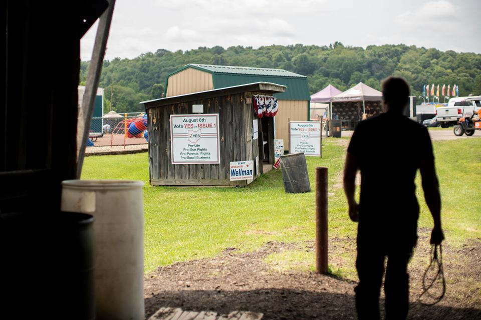 "Vote yes" signs sit at the empty Republican Party booth at the Vinton County Jr. Fair on July 28.