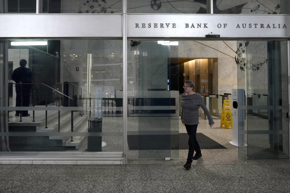 A woman walks out of the Reserve Bank of Australia in Sydney, Tuesday, June 6, 2023. Australia's central bank boosted the cash rate by a quarter of a percentage point to 4.1 percent, following a higher-than-expected 6.8% annual inflation rate for the March quarter. (AP Photo/Rick Rycroft)