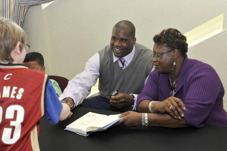 Shaquille O'Neal #33 of the Cleveland Cavaliers sits alongside his mother Lucille O'Neal as they autograph her new book 'Walk Like You Have Somewhere to Go: From Mental Welfare to Mental Wealth' prior to the game against the Milwaukee Bucks on March 31, 2010 at The Quicken Loans Arena in Cleveland, Ohio. NOTE TO USER: User expressly acknowledges and agrees that, by downloading and/or using this Photograph, user is consenting to the terms and conditions of the Getty Images License Agreement. Mandatory Copyright Notice: Copyright 2010 NBAE (Photo by David Liam Kyle/NBAE via Getty Images)