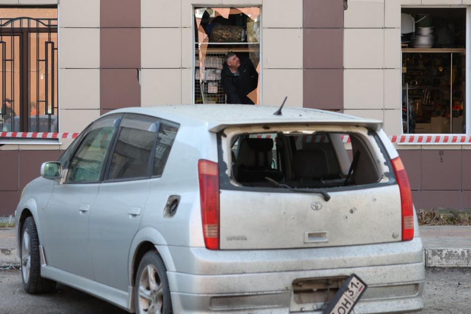 A man inspects damage to a shop following fresh aerial attacks in Belgorod (Getty)