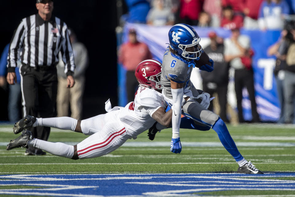FILE - Alabama defensive back Terrion Arnold (3) dives to tackle Kentucky wide receiver Dane Key (6) during the first half of an NCAA college football game in Lexington, Ky., Saturday, Nov. 11, 2023. Arnold is a possible first round pick in the NFL Draft.(AP Photo/Michelle Haas Hutchins, File)