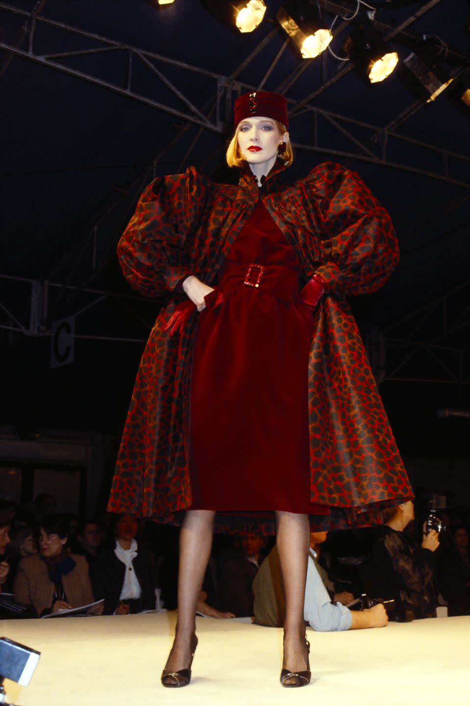 <p>A model wears a puff-sleeved red leopard-print coat at Givenchy's fall 1984 runway show during Paris Fashion Week. </p>