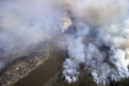 A Canadian Joint Operations Command aerial photo shows wildfires near Fort McMurray, Alberta, Canada, May 4, 2016. Courtesy MCpl VanPutten/CF Operations/Handout via REUTERS