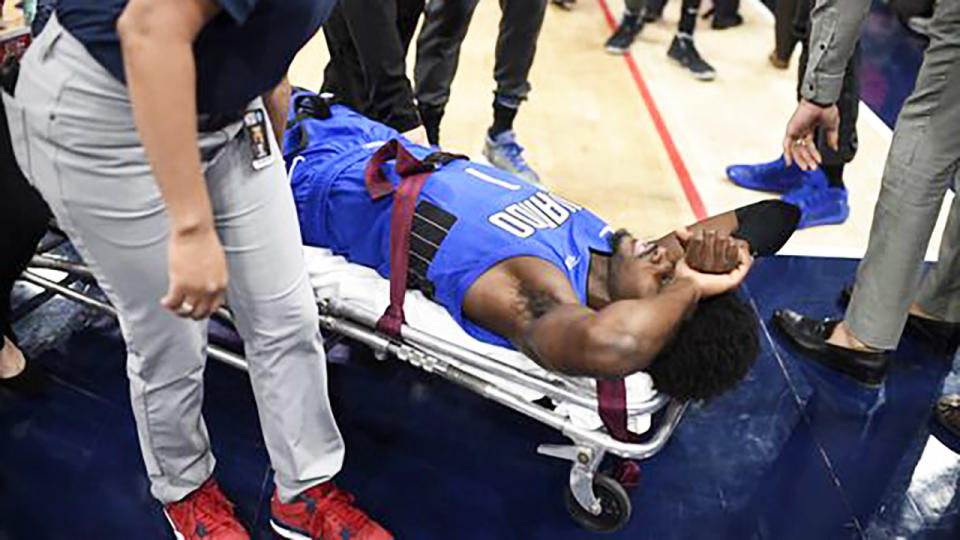 Jonathan Isaac, pictured here being taken from the court on a stretcher.