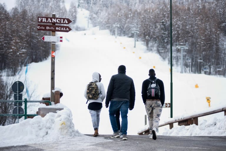 Migrants head towards the Col de l'Echelle mountain pass in a bid to cross from Italy into France