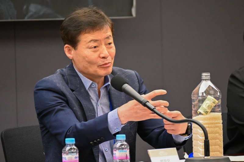 Park Jung-oh, head of activist group Kuen Saem, discusses sending bottles filled with rice, dollar bills and USB hard drives into North Korea at the Seoul Freedom Forum on Monday. Photo by Thomas Maresca/UPI