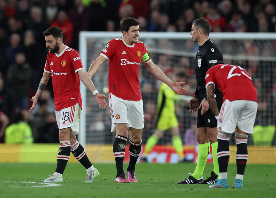 Manchester United's Harry Maguire (centre) remonstrates with referee Slavko Vincic.