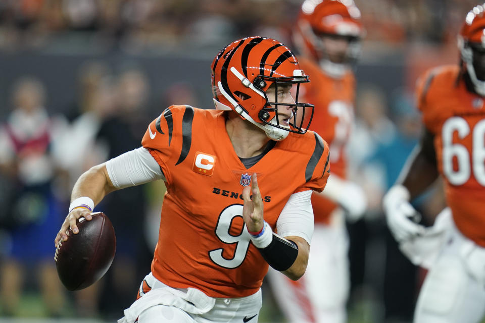 Cincinnati Bengals quarterback Joe Burrow (9) looks to throw during the first half of an NFL football game against the Jacksonville Jaguars, Thursday, Sept. 30, 2021, in Cincinnati. (AP Photo/Michael Conroy)